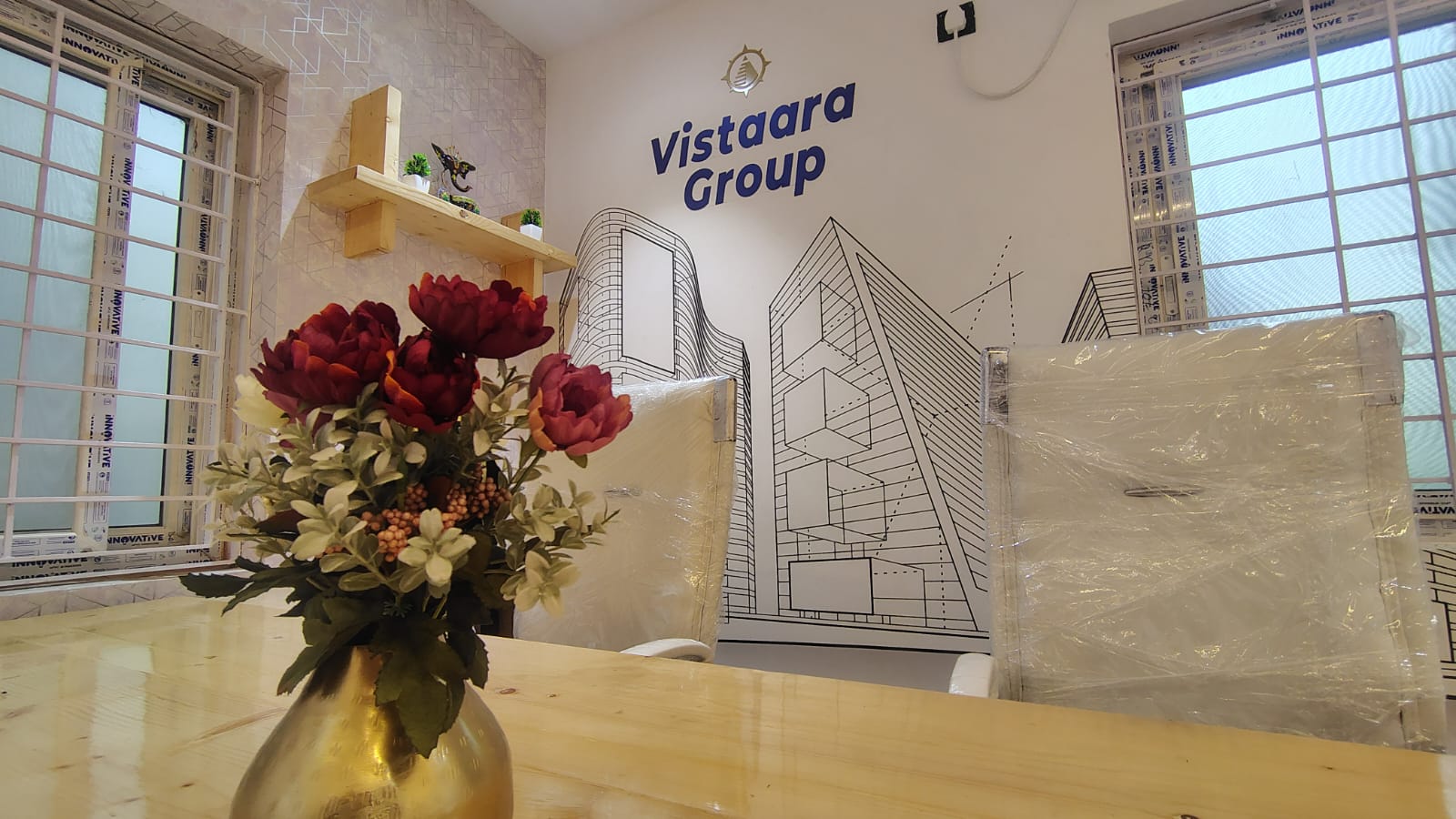 Meeting room — branded wall graphic and skyline mural