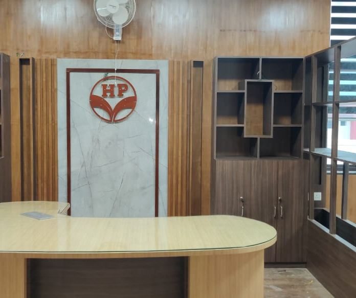 Reception — branded HP feature wall and curved counter